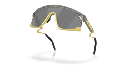 Oakley Sunglass BXTR Metal Alloy Collection prizm black Lenses With matte grey ink/vintage gold Frame