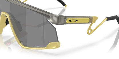 Oakley Sunglass BXTR Metal Alloy Collection prizm black Lenses With matte grey ink/vintage gold Frame