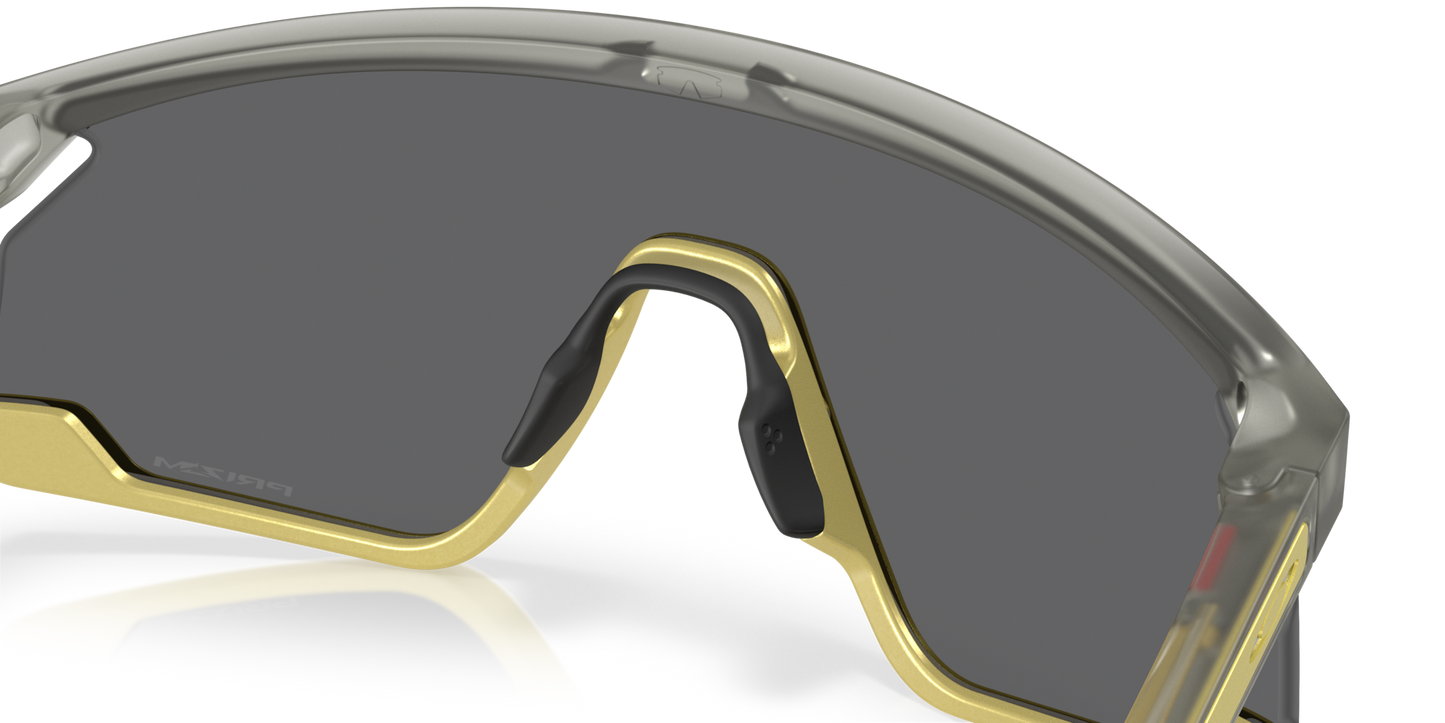 Oakley Sunglass BXTR Metal Alloy Collection prizm black Lenses With matte grey ink/vintage gold Frame